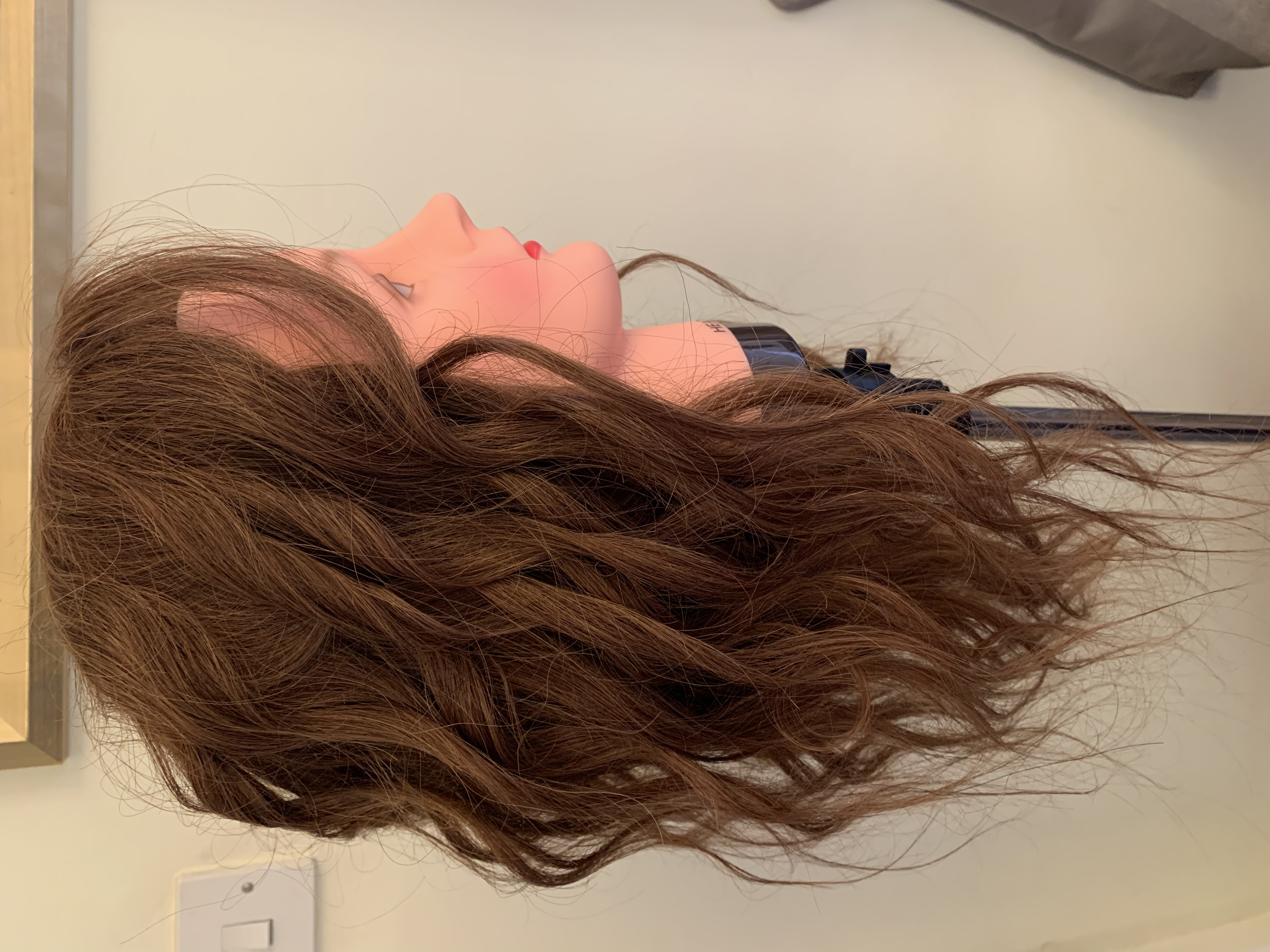 Curling with hair straighteners side view